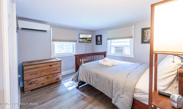 a view of a livingroom with furniture and wooden floor