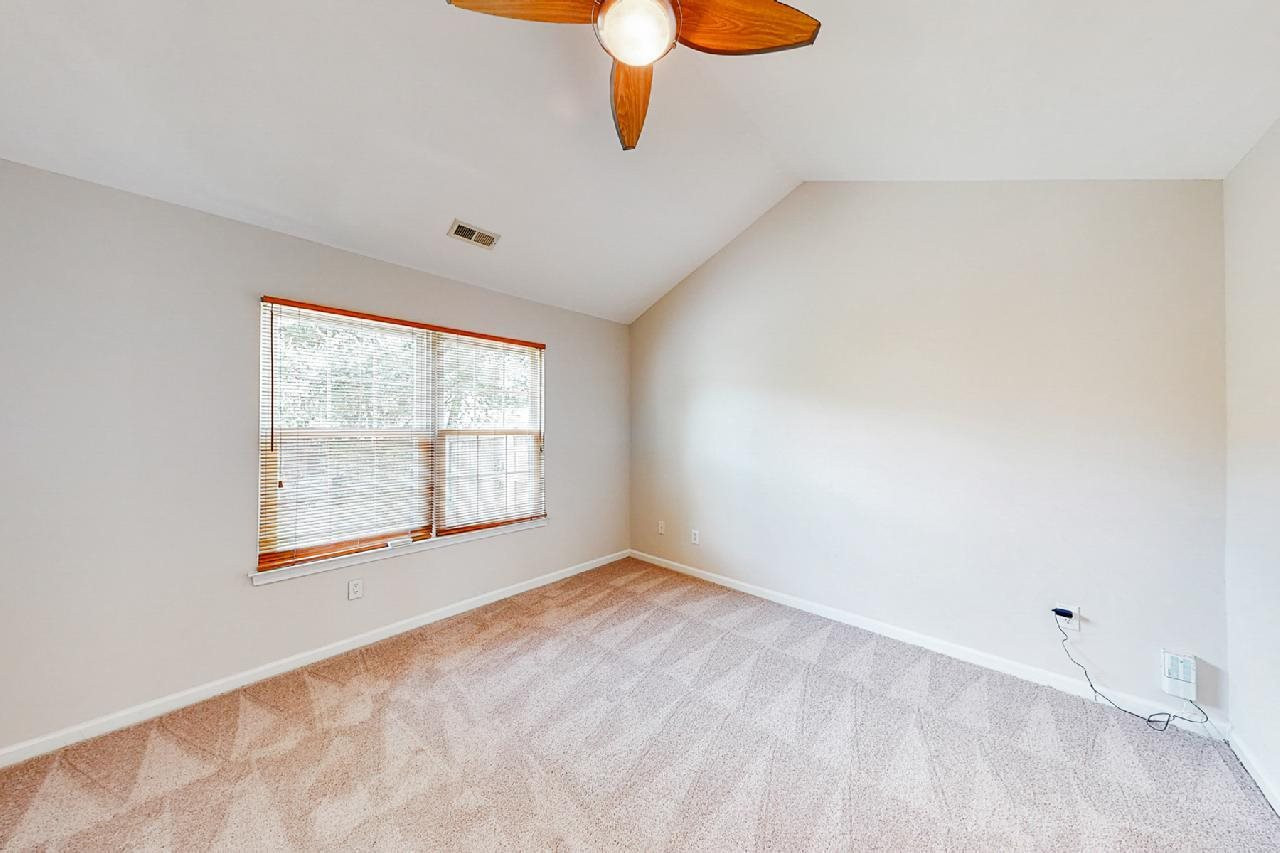 Main floor owners suite with vaulted ceiling Owner's Suite