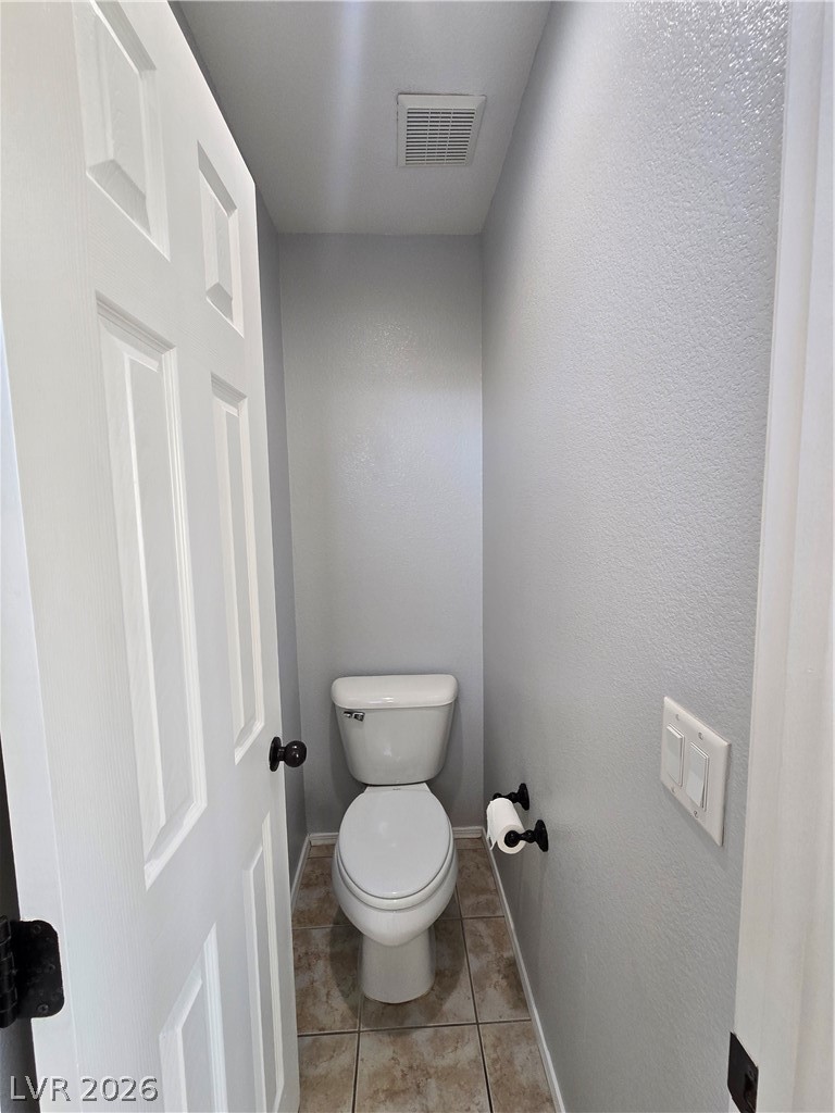 1049 Garnet Ridge Court Las Vegas, NV 89123 - Photo 16 of 39 Bathroom with a textured wall and light tile patterned floors