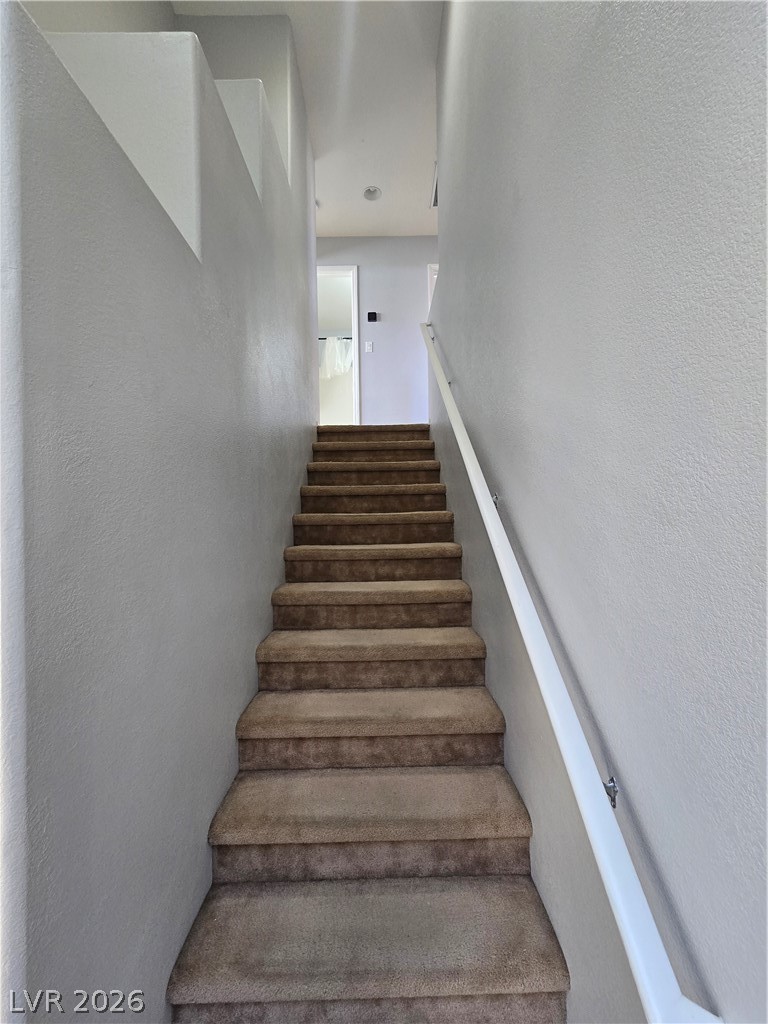1049 Garnet Ridge Court Las Vegas, NV 89123 - Photo 19 of 39 Stairway with a textured wall