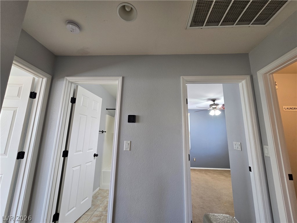 1049 Garnet Ridge Court Las Vegas, NV 89123 - Photo 20 of 39 Hall with light carpet and baseboards