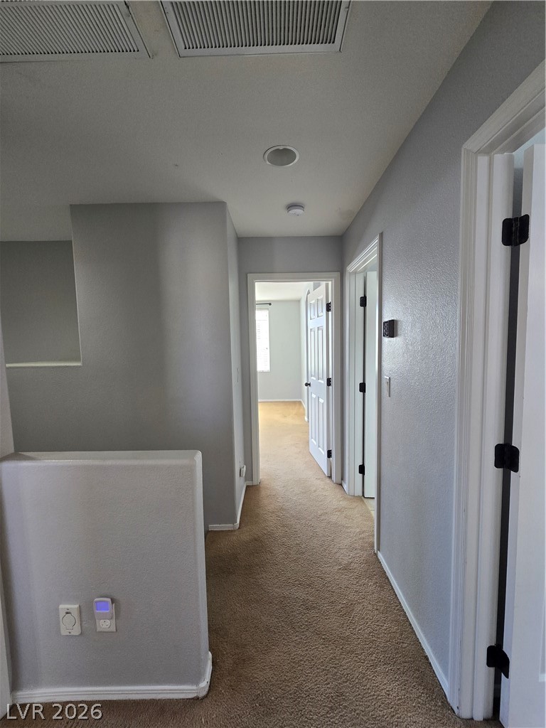 1049 Garnet Ridge Court Las Vegas, NV 89123 - Photo 23 of 39 Hall with carpet and baseboards