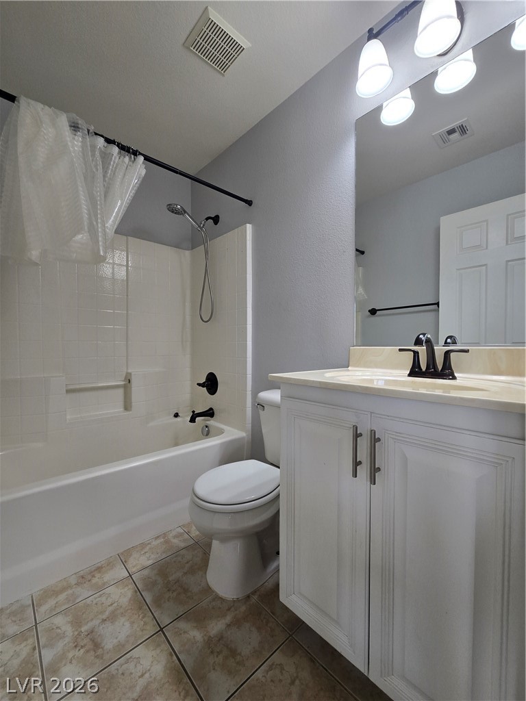 1049 Garnet Ridge Court Las Vegas, NV 89123 - Photo 33 of 39 Full bathroom with shower / bath combo, vanity, and light tile patterned flooring