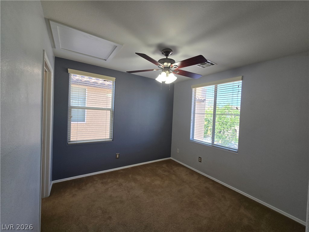 1049 Garnet Ridge Court Las Vegas, NV 89123 - Photo 34 of 39 Empty room with ceiling fan and dark carpet