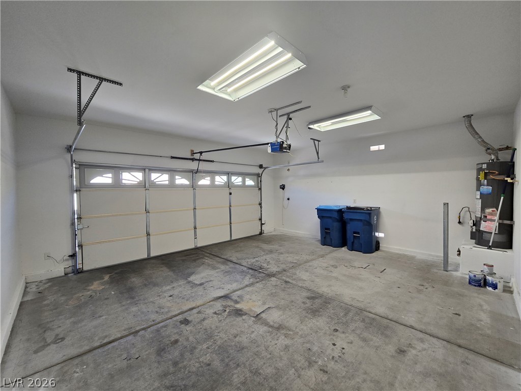 1049 Garnet Ridge Court Las Vegas, NV 89123 - Photo 37 of 39 Garage with water heater and baseboards