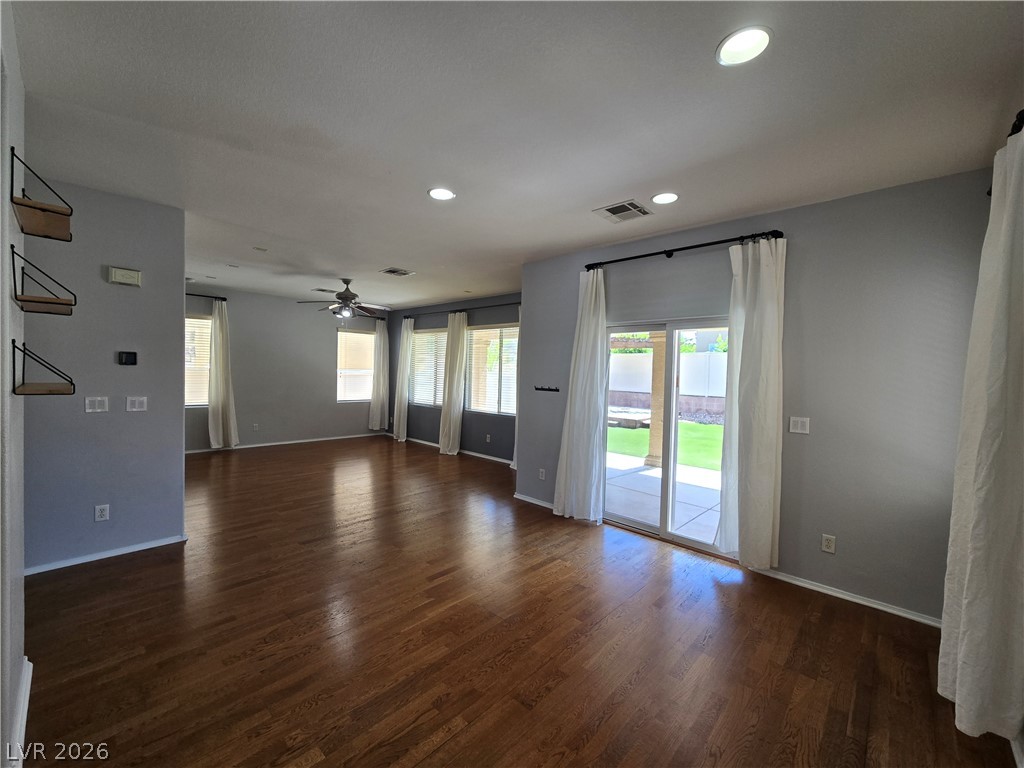 1049 Garnet Ridge Court Las Vegas, NV 89123 - Photo 8 of 39 Unfurnished living room with dark wood-style floors, plenty of natural light, recessed lighting, and ceiling fan
