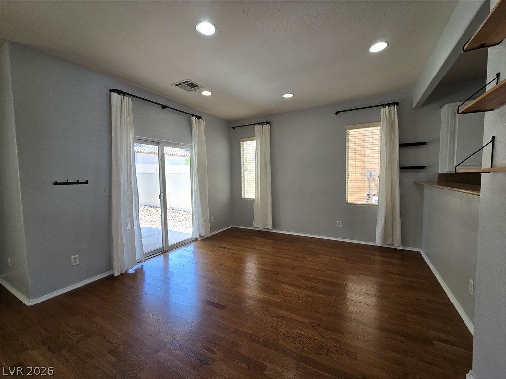 1049 Garnet Ridge Court Las Vegas, NV 89123 - Photo 10 of 39 Spare room featuring dark wood-type flooring and recessed lighting
