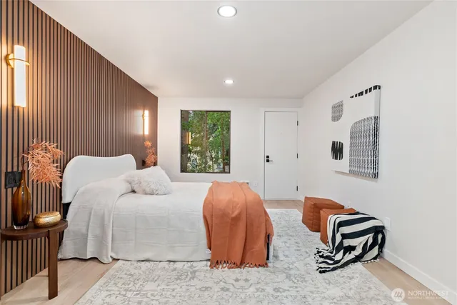 a bedroom with furniture and a window