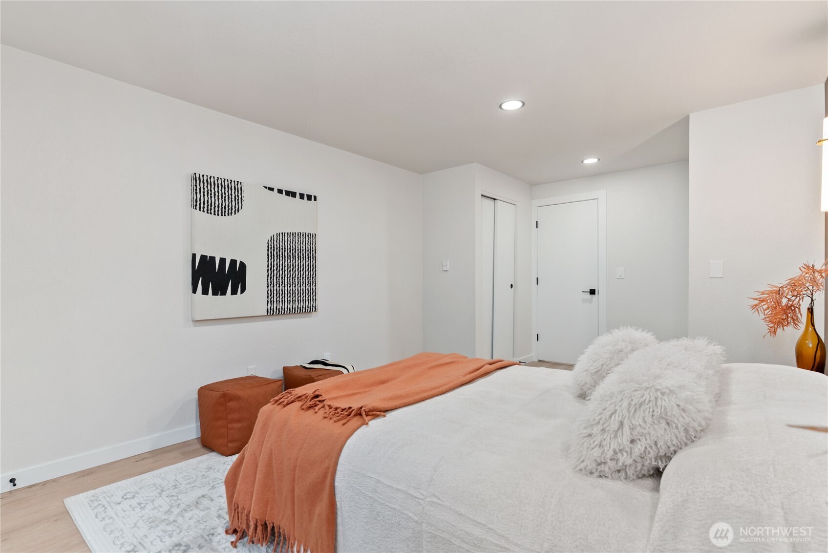 155 South 330th Street, Unit D Federal Way, WA 98003 - Photo 18 of 35 a bedroom with a bed and painting on the wall