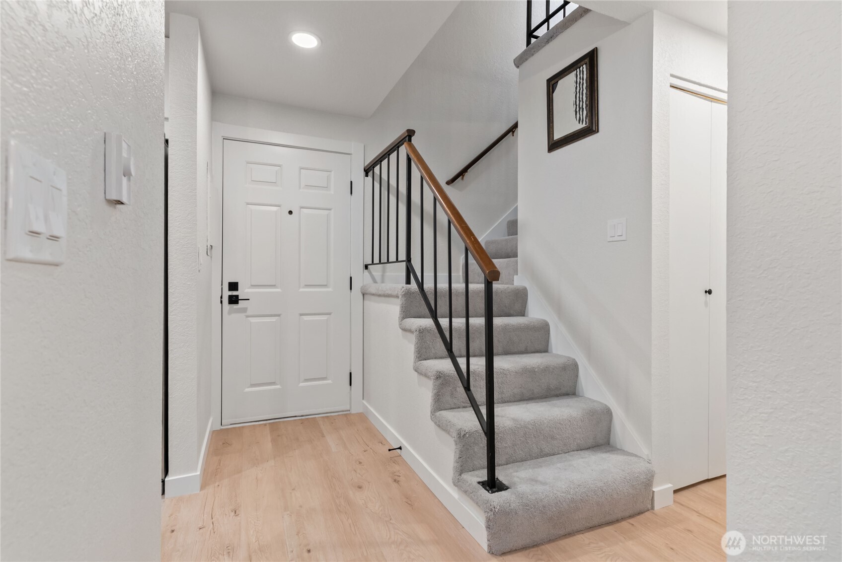155 South 330th Street, Unit D Federal Way, WA 98003 - Photo 2 of 35 a view of entryway and hall with wooden floor