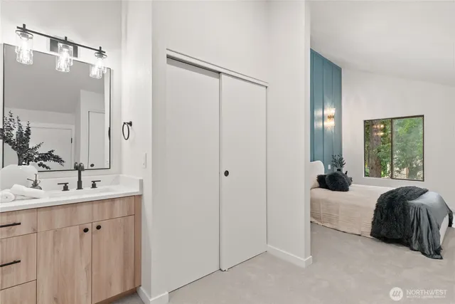 a bathroom with a double vanity sink and mirror