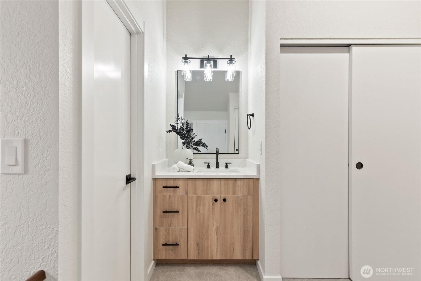 155 South 330th Street, Unit D Federal Way, WA 98003 - Photo 25 of 35 a bathroom with a double vanity sink and mirror