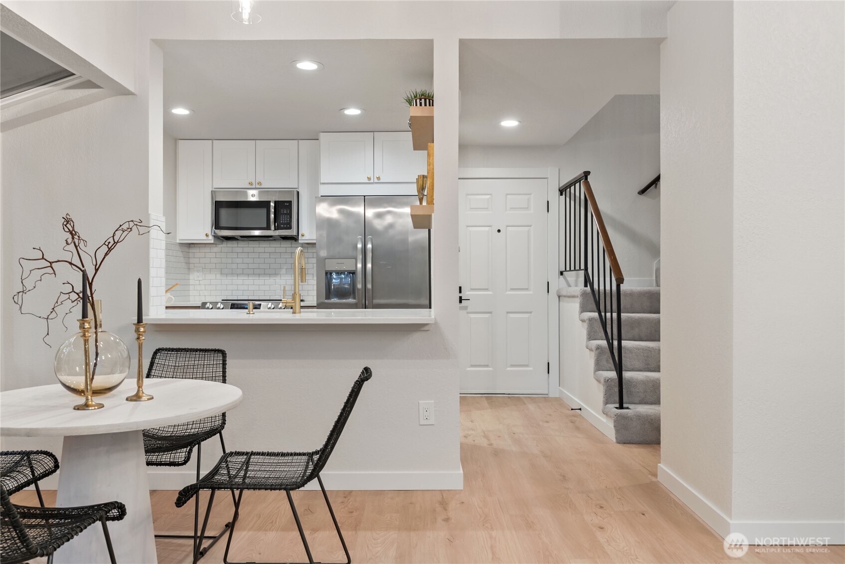 155 South 330th Street, Unit D Federal Way, WA 98003 - Photo 10 of 35 a kitchen with stainless steel appliances granite countertop a refrigerator and a stove top oven