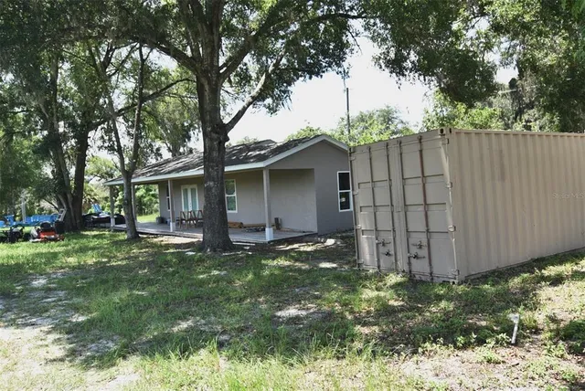 a view of a street both of side of trees