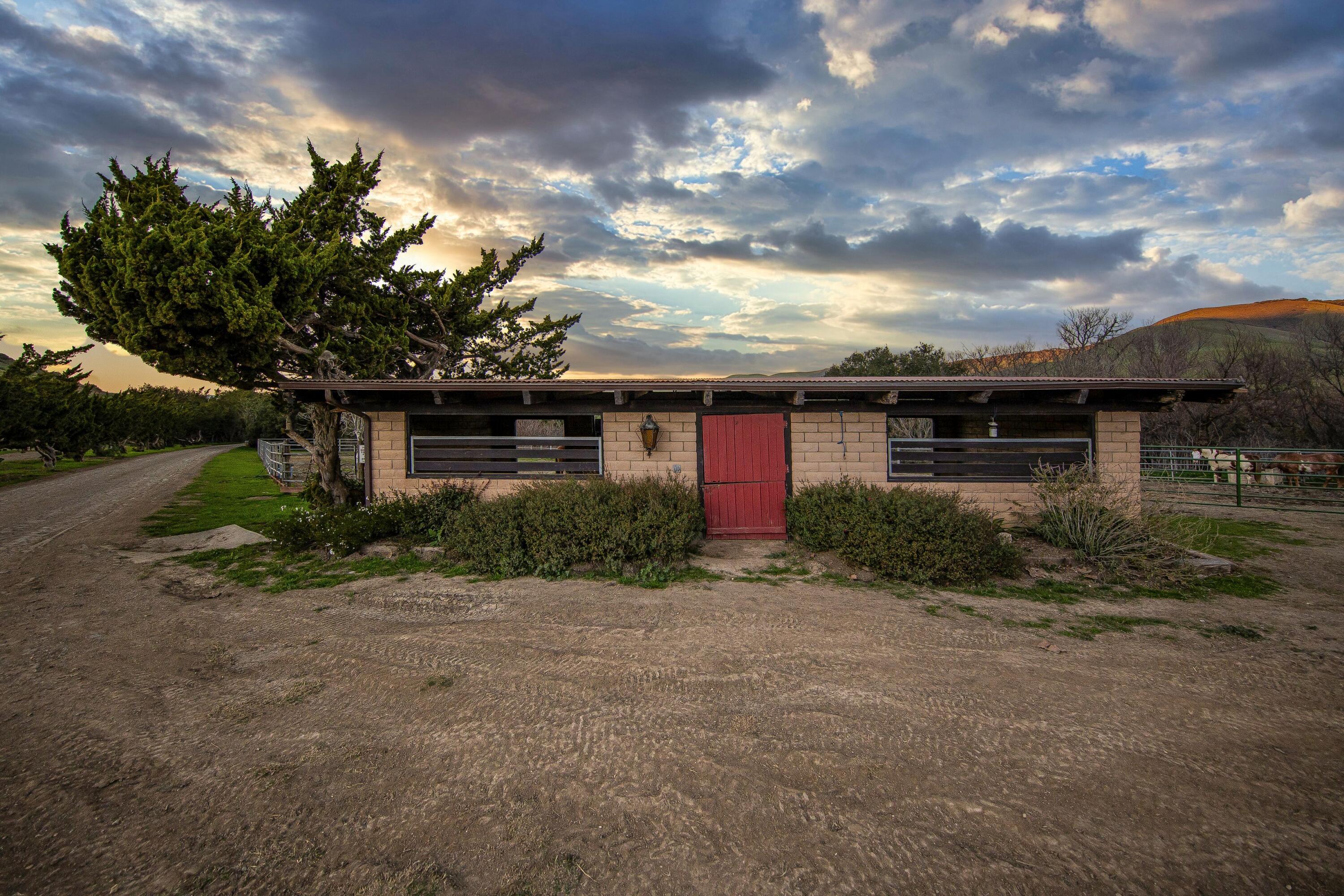 4115 Jalama Road Lompoc, CA 93436 - Photo 11 of 39 a front view of a house with a yard and garage