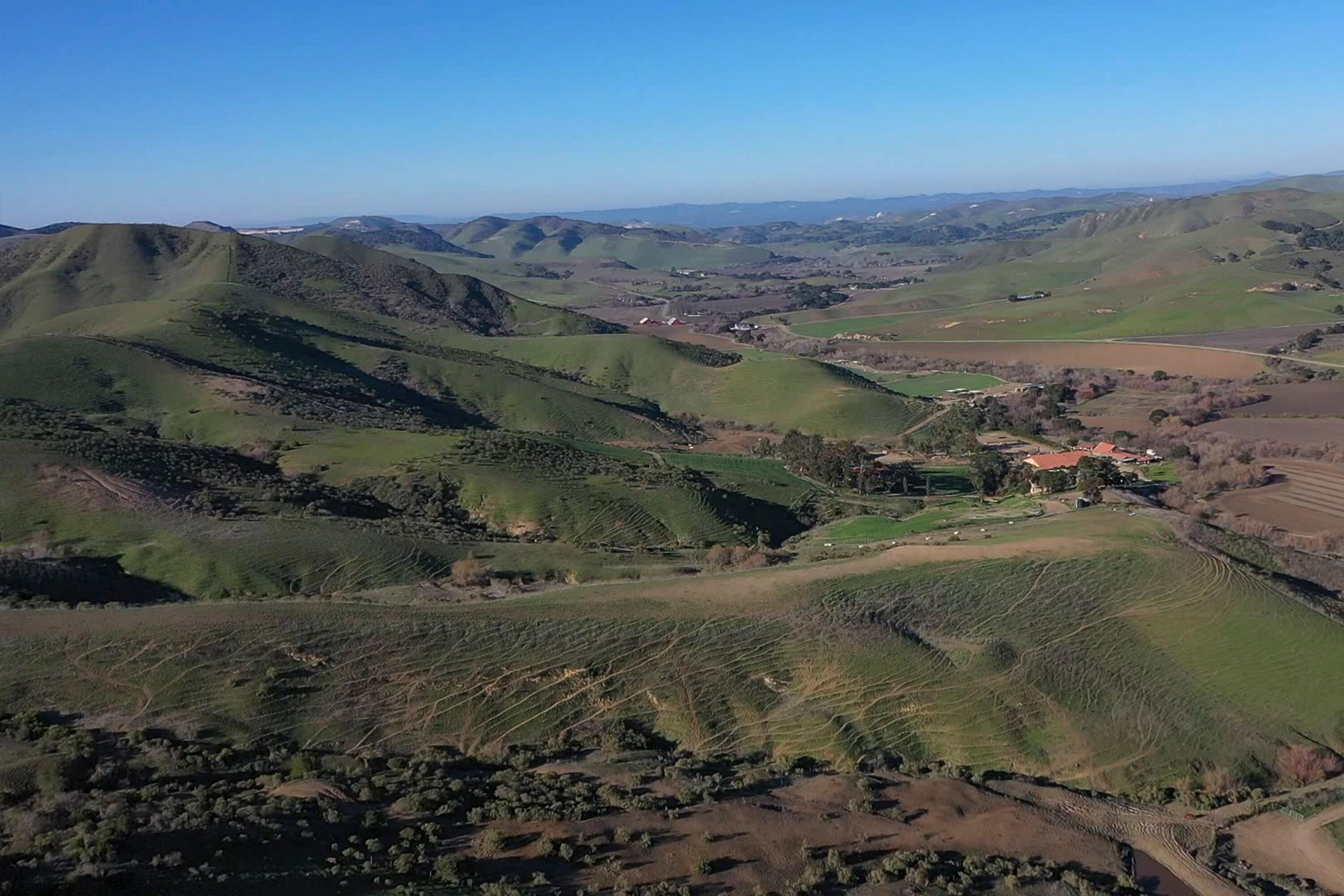 4115 Jalama Road Lompoc, CA 93436 - Photo 24 of 39 a view of a lake with mountains in the background