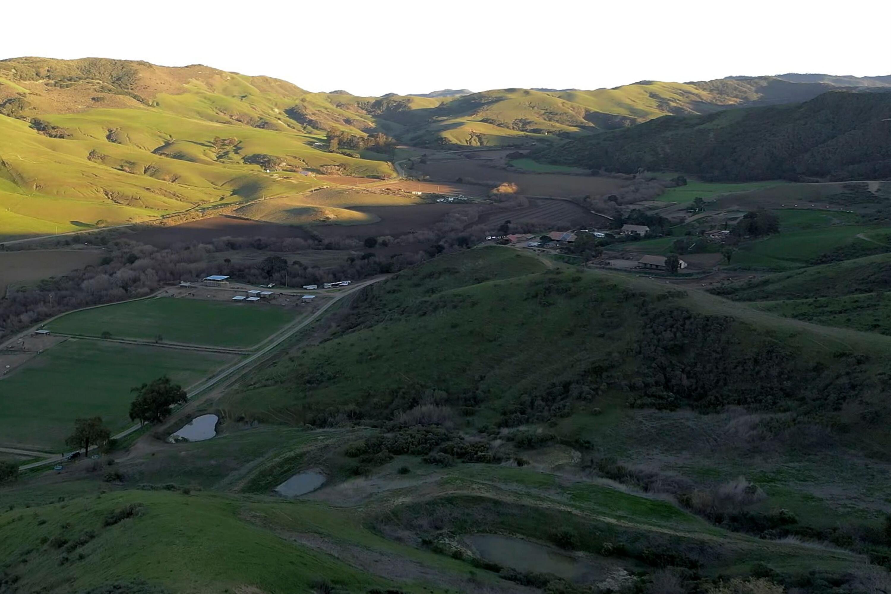 4115 Jalama Road Lompoc, CA 93436 - Photo 25 of 39 a view of a lush green hillside and houses