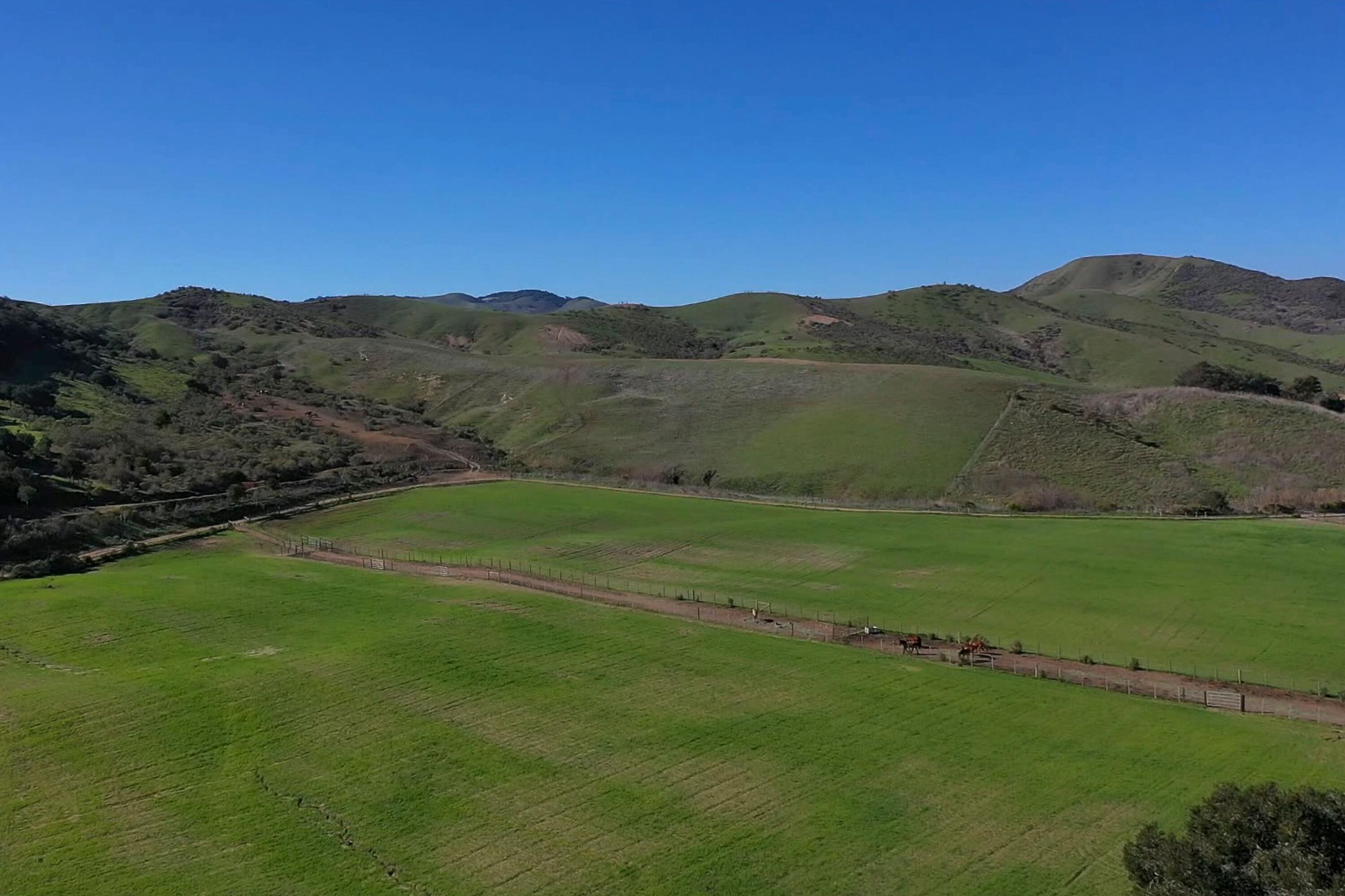 4115 Jalama Road Lompoc, CA 93436 - Photo 28 of 39 a view of a lake with a mountain in the background