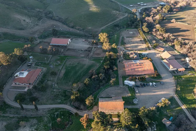 an aerial view of houses with yard