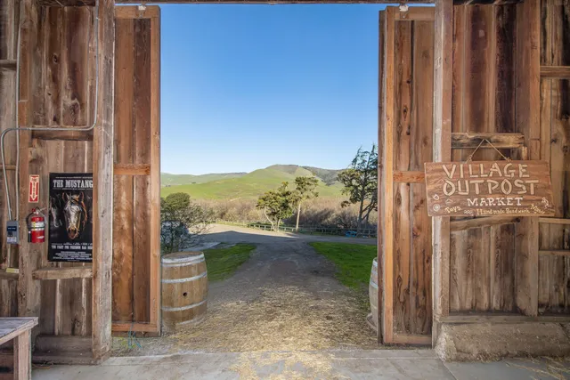 a view of a balcony with table and chairs