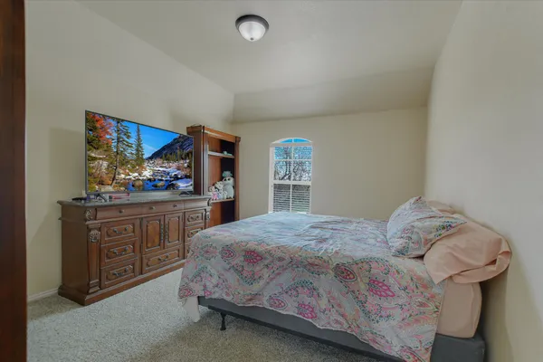 a bedroom with a bed and cabinets