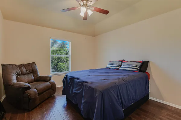 a bedroom with a bed and window
