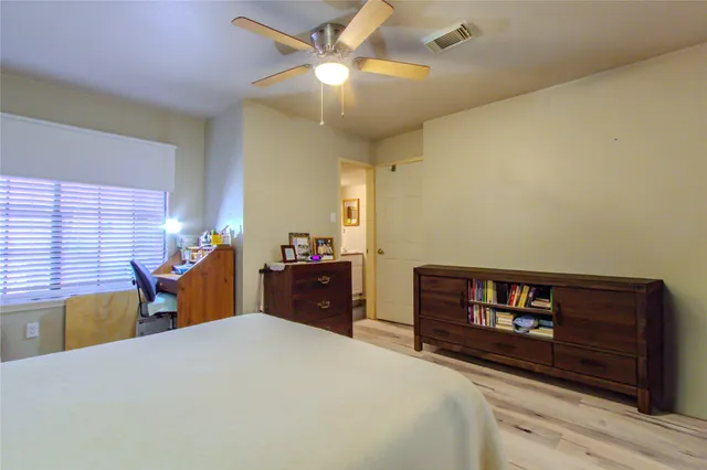 a bed room with a bed and a chandelier