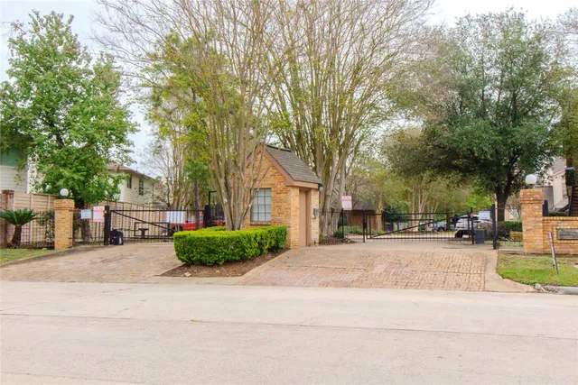 a front view of a house with a yard and outdoor seating