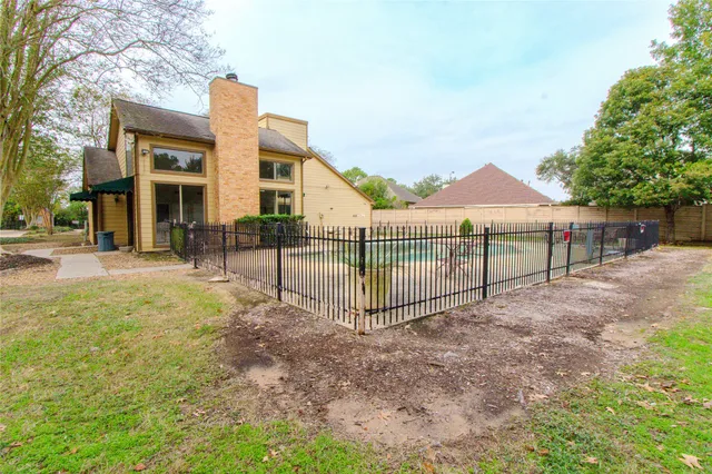 a view of a wrought iron fences in front of house
