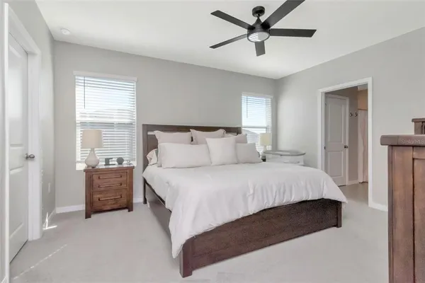 a bedroom with a bed and window