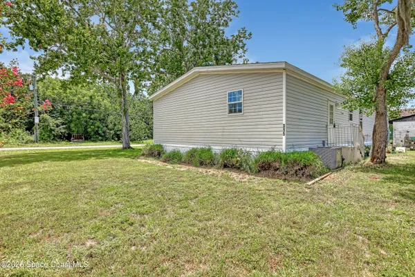 a backyard of a house with seating space