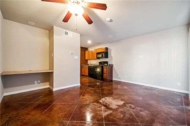 a view of a kitchen with a sink and a stove