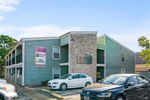 a front view of a house with parking space