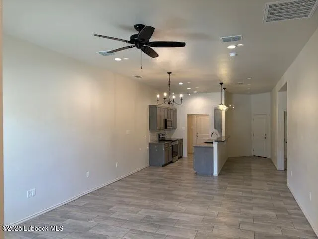 a view of a kitchen and a refrigerator