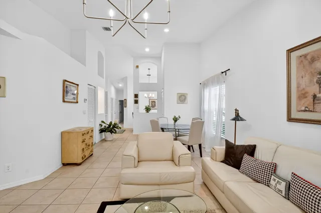 a kitchen with a sink a refrigerator a microwave and cabinets