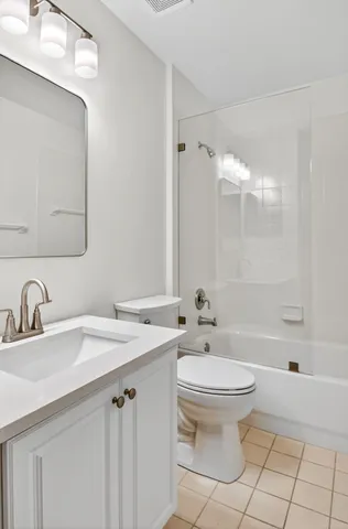 an aerial view of residential houses with outdoor space and street view