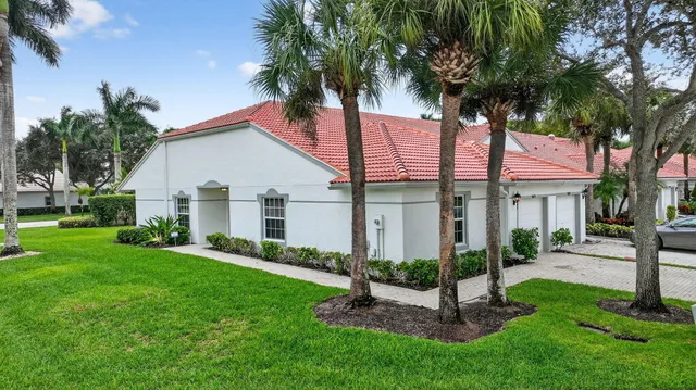 a view of a patio with a table and chairs