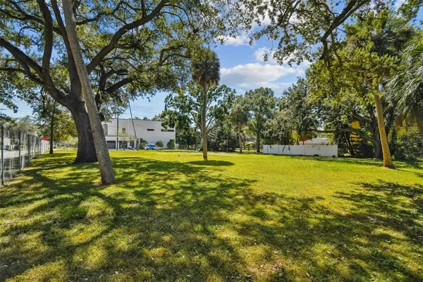 a view of yard with swimming pool