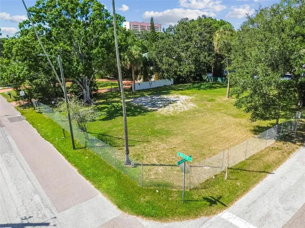 a view of a backyard with swimming pool