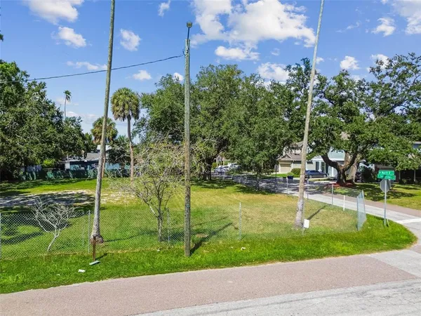 a view of a swimming pool with a yard