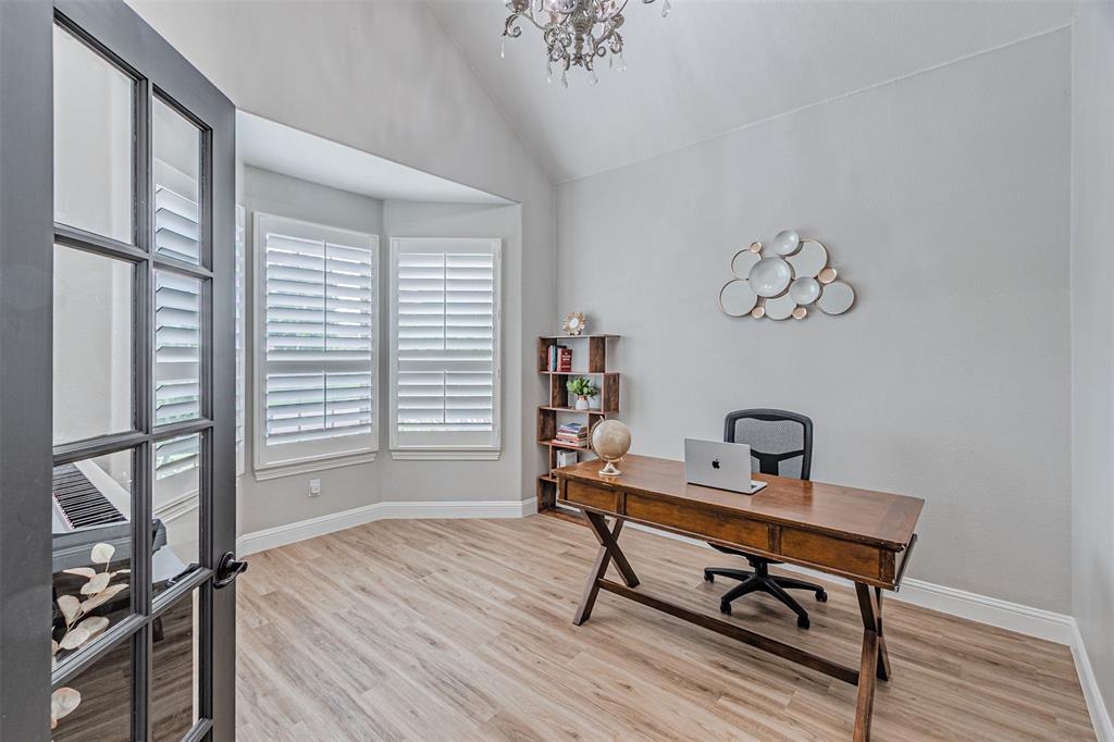 1805 Stetson Way Allen, TX 75002 - Photo 14 of 22 French doors open to a versatile room featuring wood-finish flooring, a vaulted ceiling, and a bay window with plantation shutters