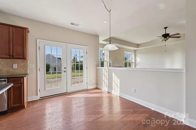 a view of a kitchen with a sink and a window