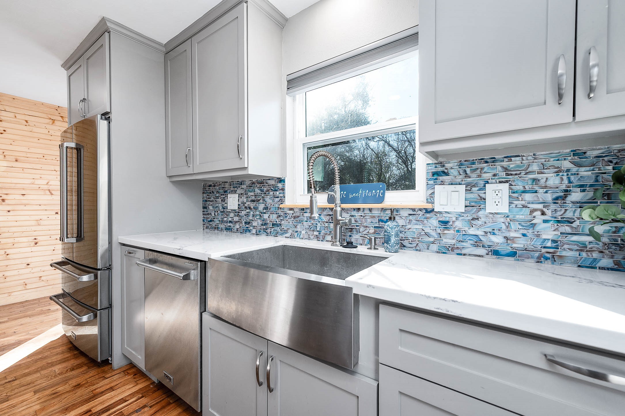 2738 Lilac Street Pasadena, TX 77503 - Photo 11 of 26 a kitchen with a sink and a refrigerator