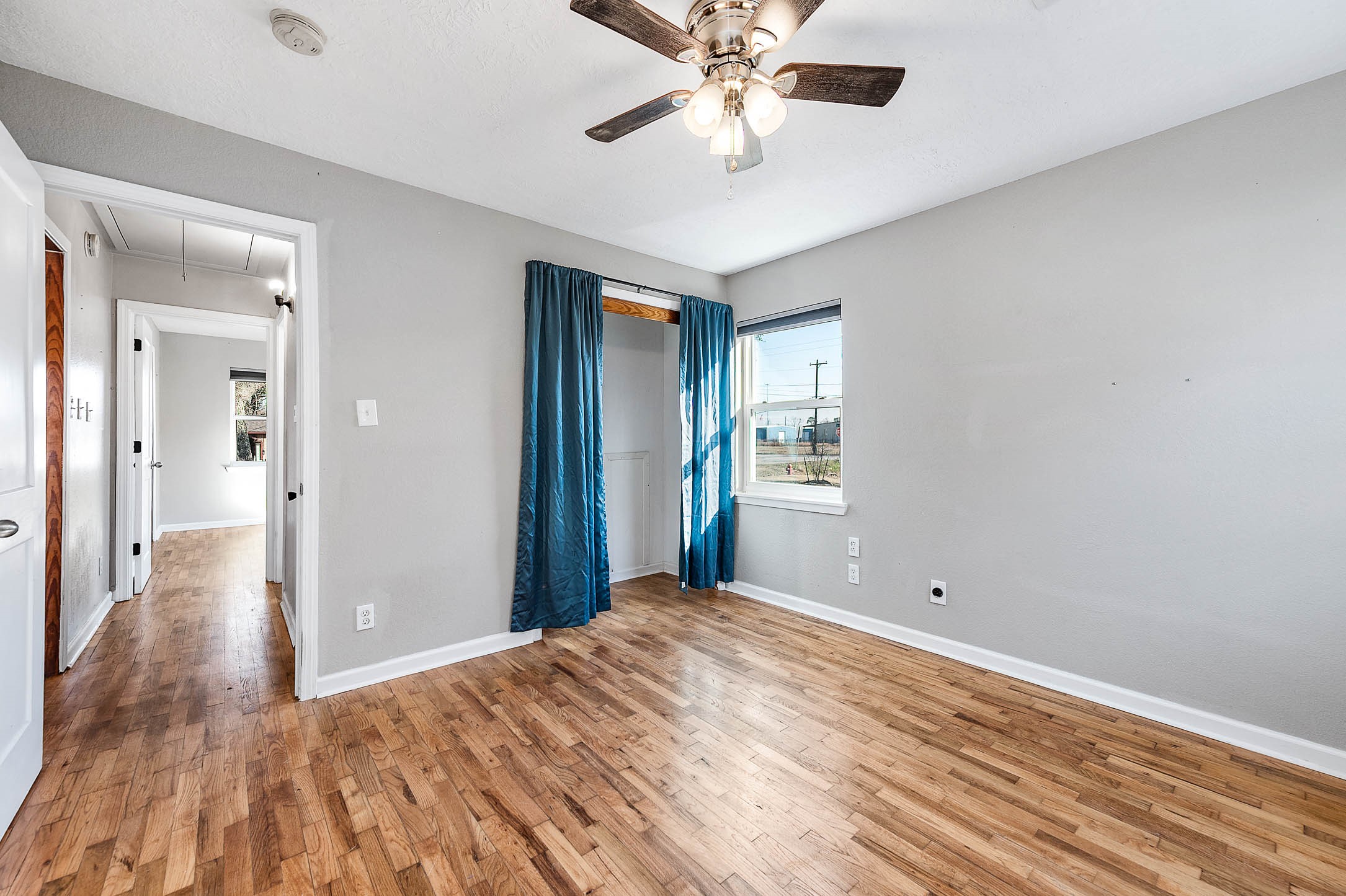 2738 Lilac Street Pasadena, TX 77503 - Photo 16 of 26 a view of a room with wooden floor and ceiling fan