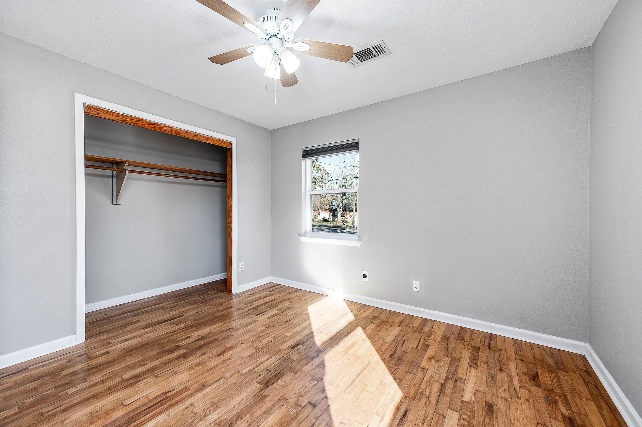 2738 Lilac Street Pasadena, TX 77503 - Photo 20 of 26 wooden floor in an empty room with a window