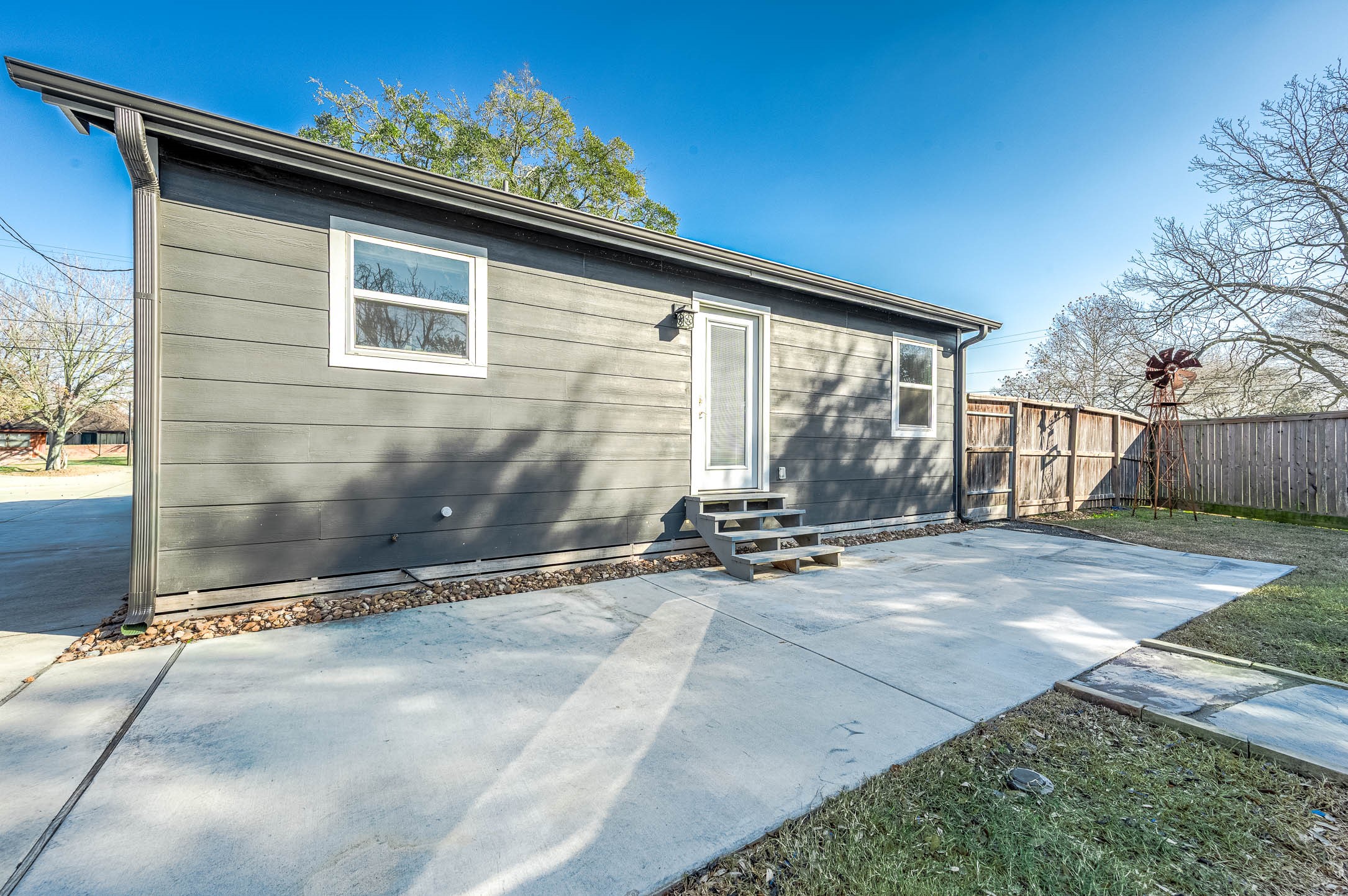 2738 Lilac Street Pasadena, TX 77503 - Photo 22 of 26 a backyard of a house with table and chairs