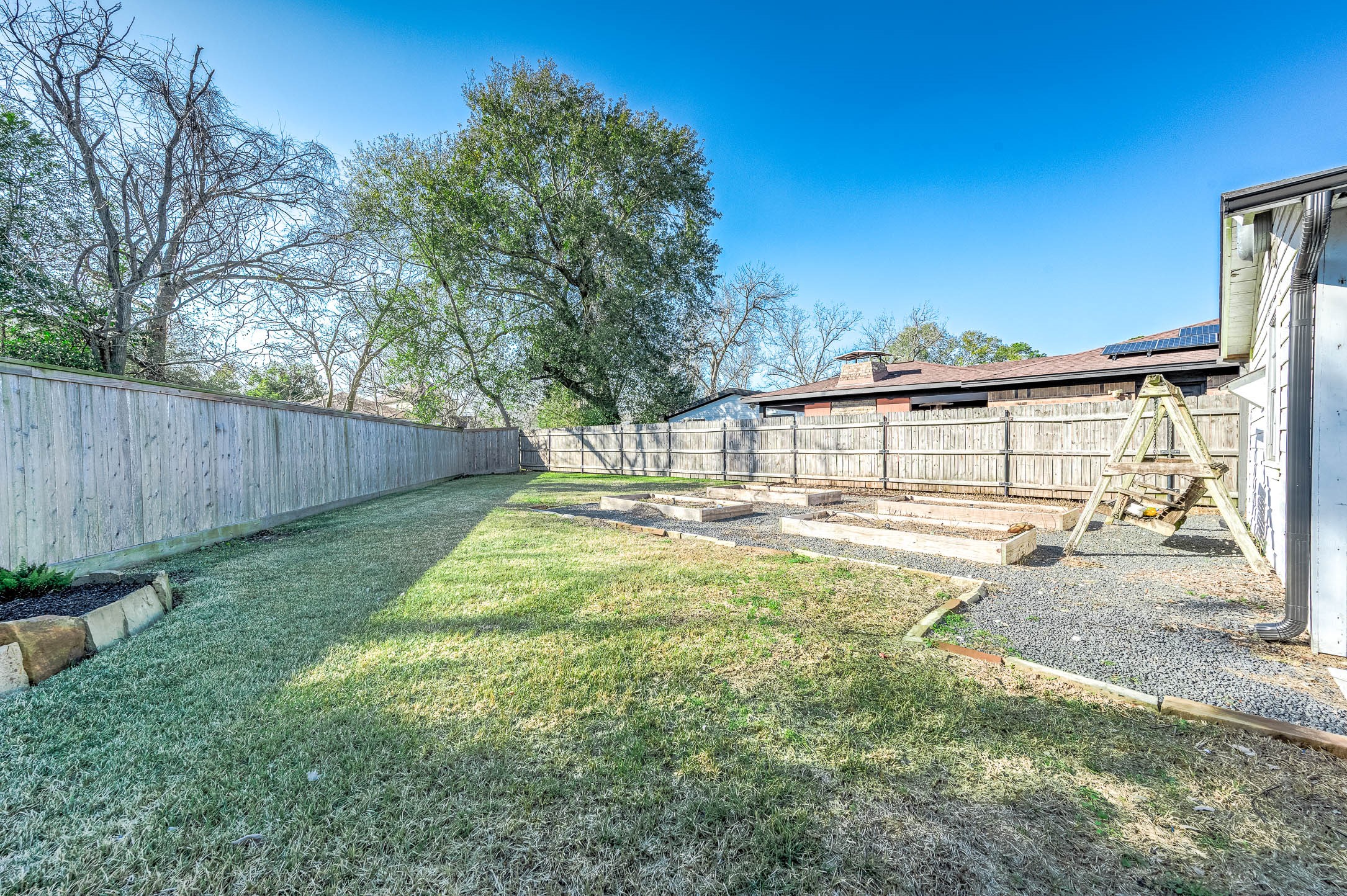 2738 Lilac Street Pasadena, TX 77503 - Photo 23 of 26 a view of a backyard with a large tree
