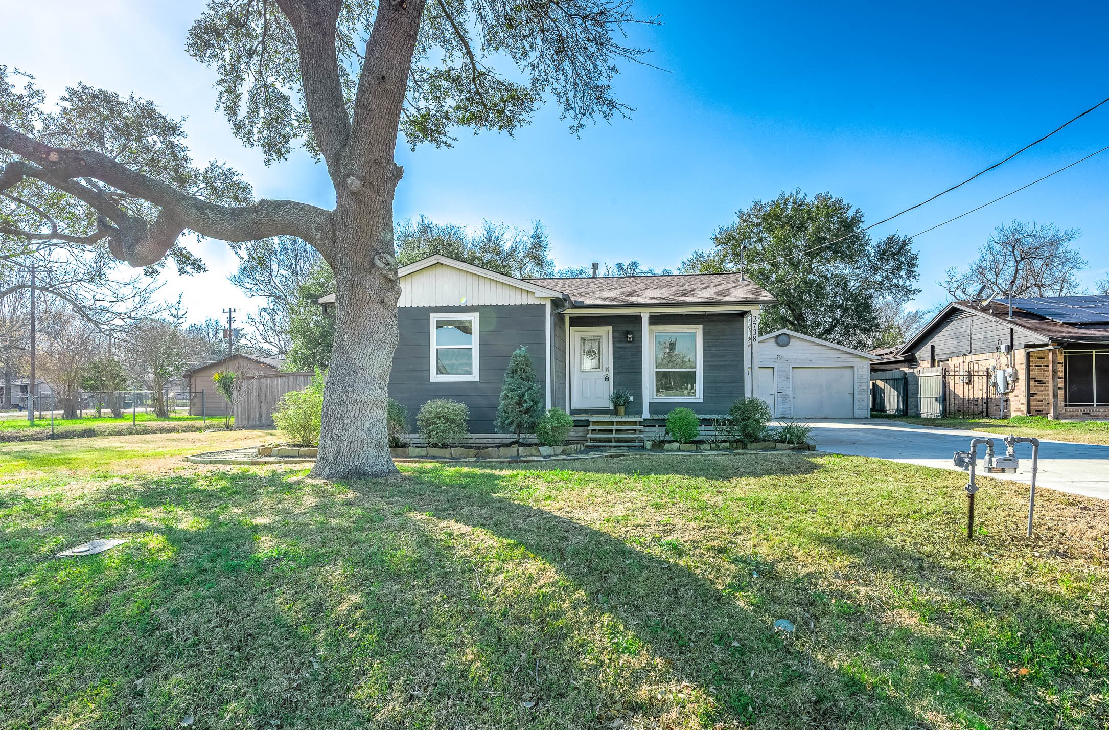 2738 Lilac Street Pasadena, TX 77503 - Photo 4 of 26 a view of house with a big yard and large trees