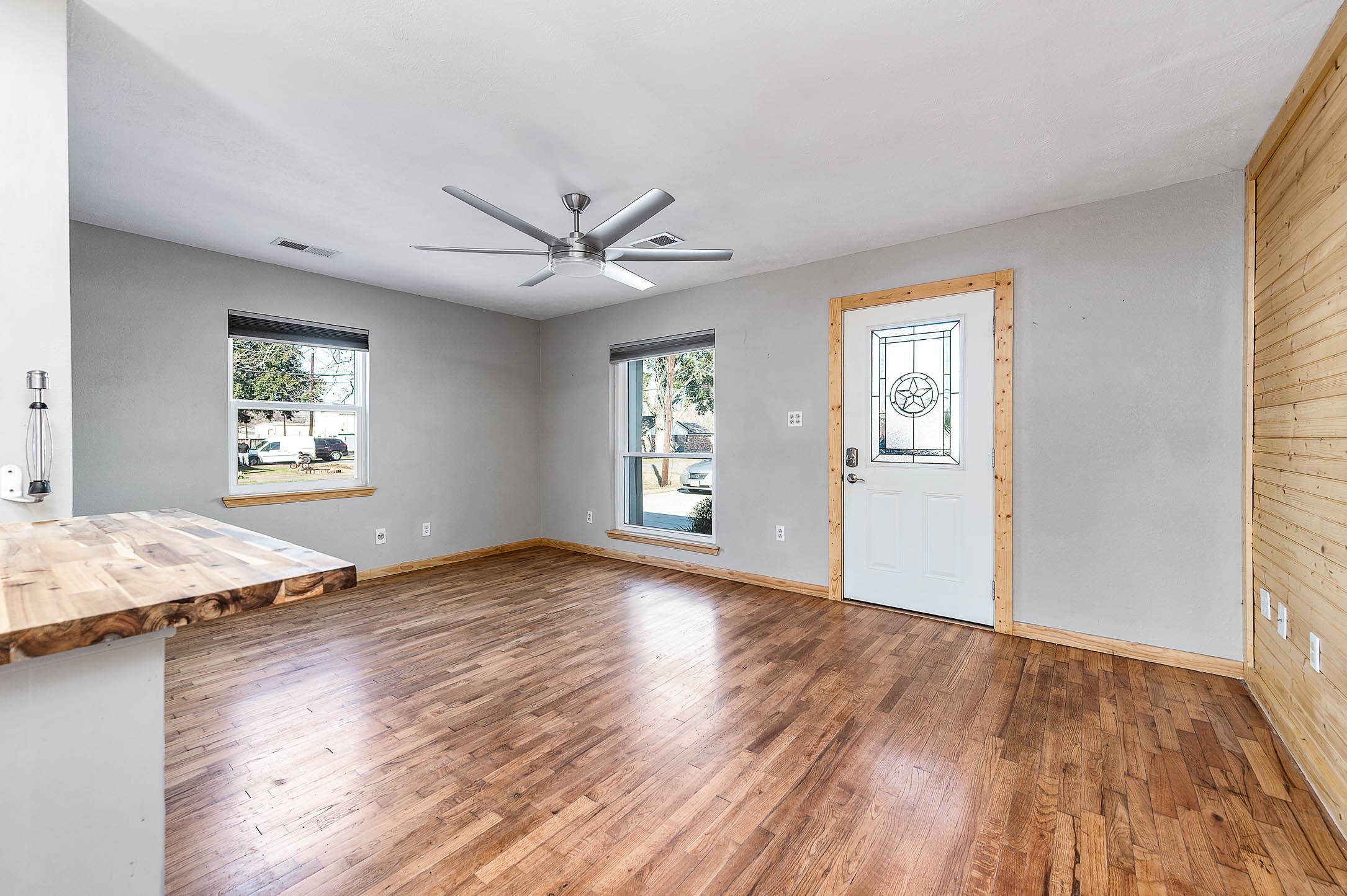 2738 Lilac Street Pasadena, TX 77503 - Photo 6 of 26 a view of an empty room with a window and wooden floor