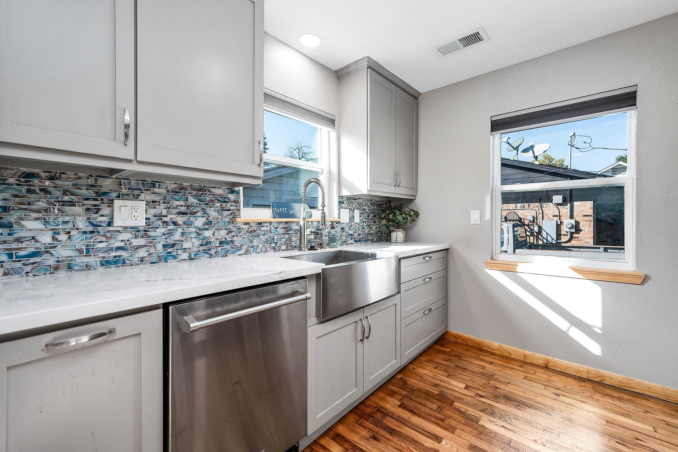 2738 Lilac Street Pasadena, TX 77503 - Photo 9 of 26 a kitchen with white cabinets and window